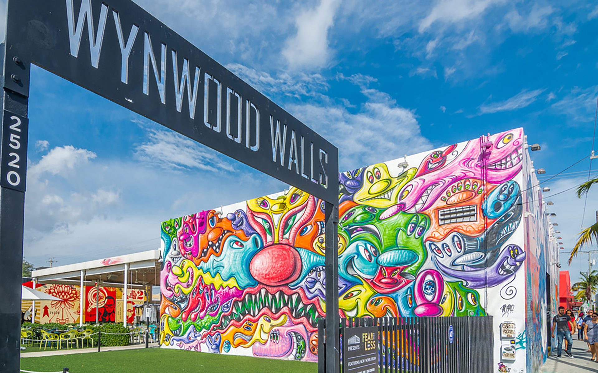 Street artists paint the walls of the new Miami Dolphins stadium