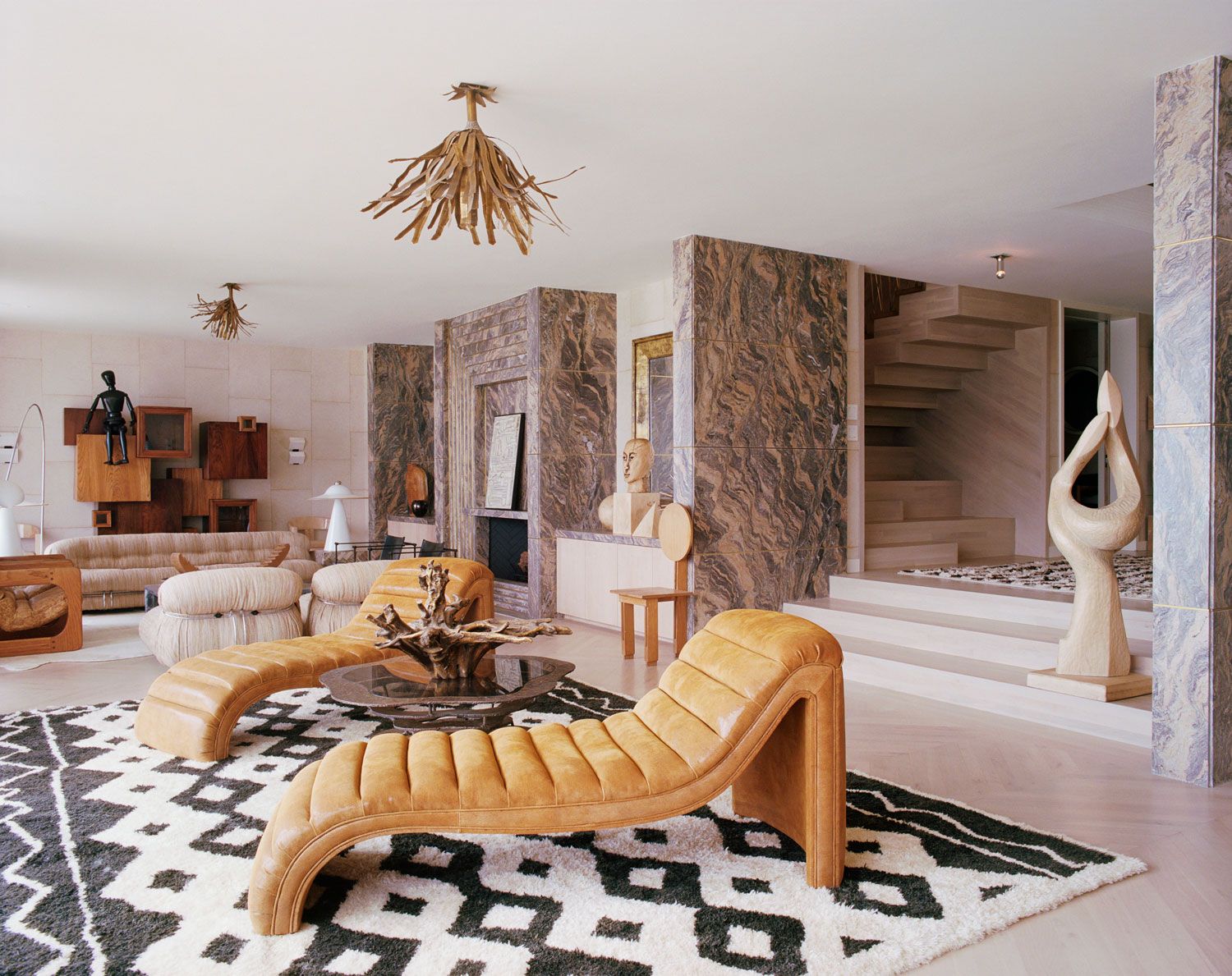 A Malibu living room designed by Kelly Wearstler features honed and leathered finishes on Bardiglio marble.