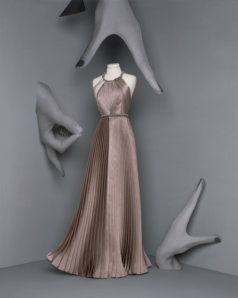 Dior’s Hedda Look: Long “Peplum” dress in greige pleated crepe satin.