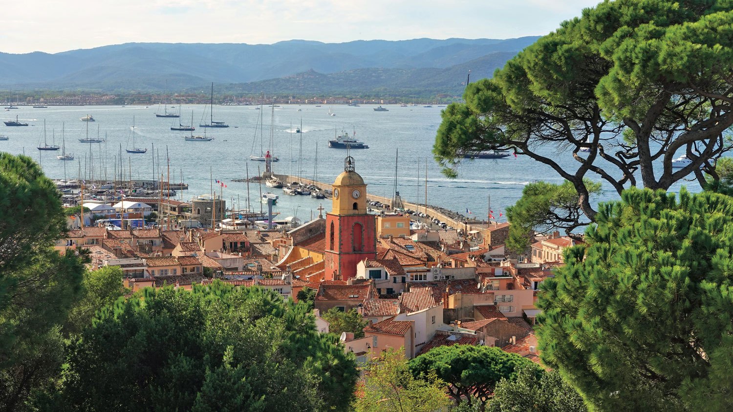 View of the city of St. Tropez from the Citadel featuring the iconic bell tower of the Church of St. Tropez.