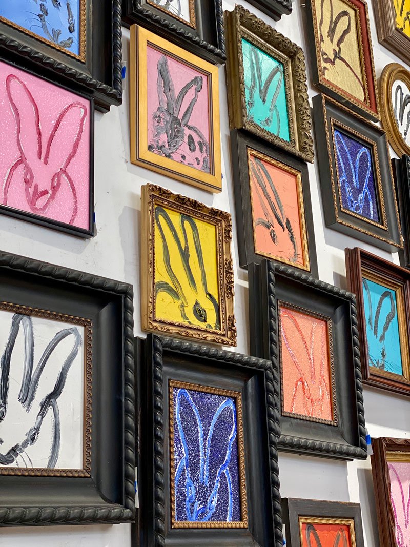 A wall lined with Hunt Slonem’s signature bunny paintings.
