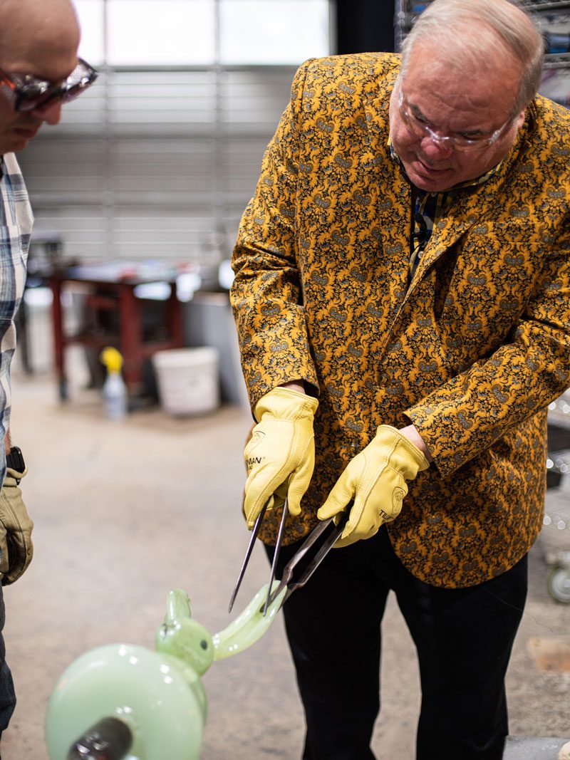 In Seattle’s Glass Eye Studio, Slonem shapes one of his glass bunnies’ ears.