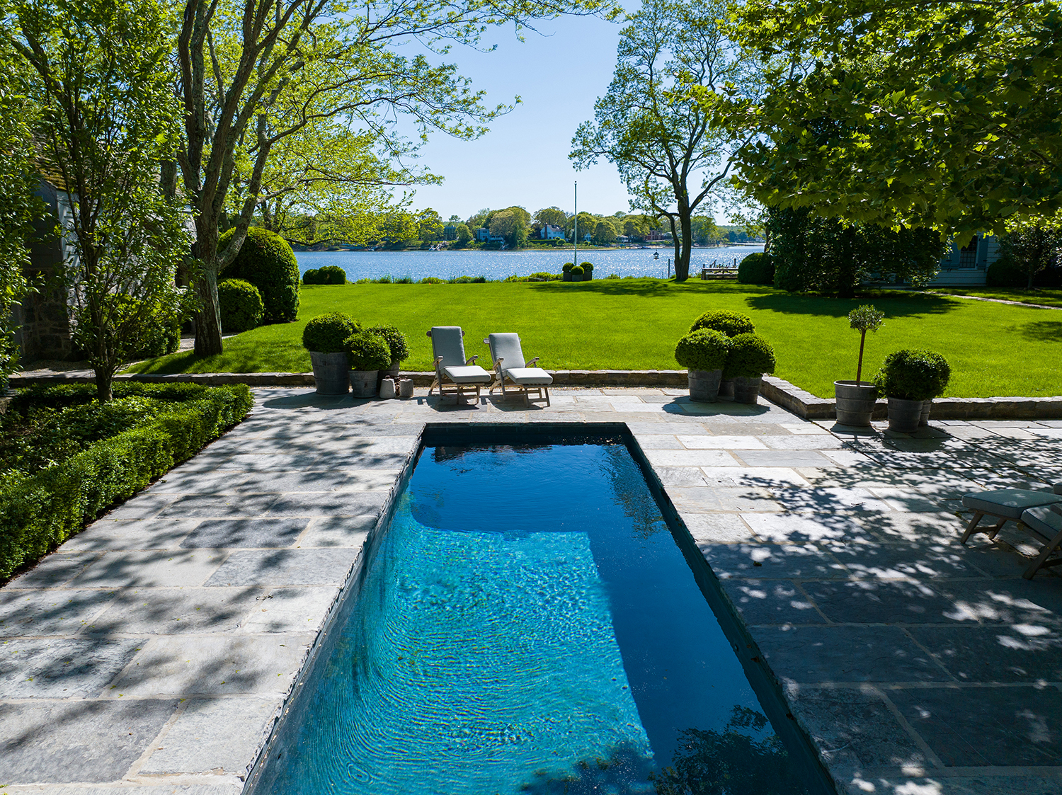 Steven Gambrel's property features a covered bluestone patio overlooking the heated gunite pool.