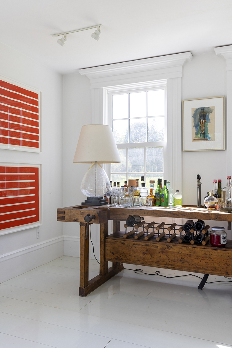 A pair of Donald Judd prints electrify an entertaining area in Drew Hodges' home in Maine.