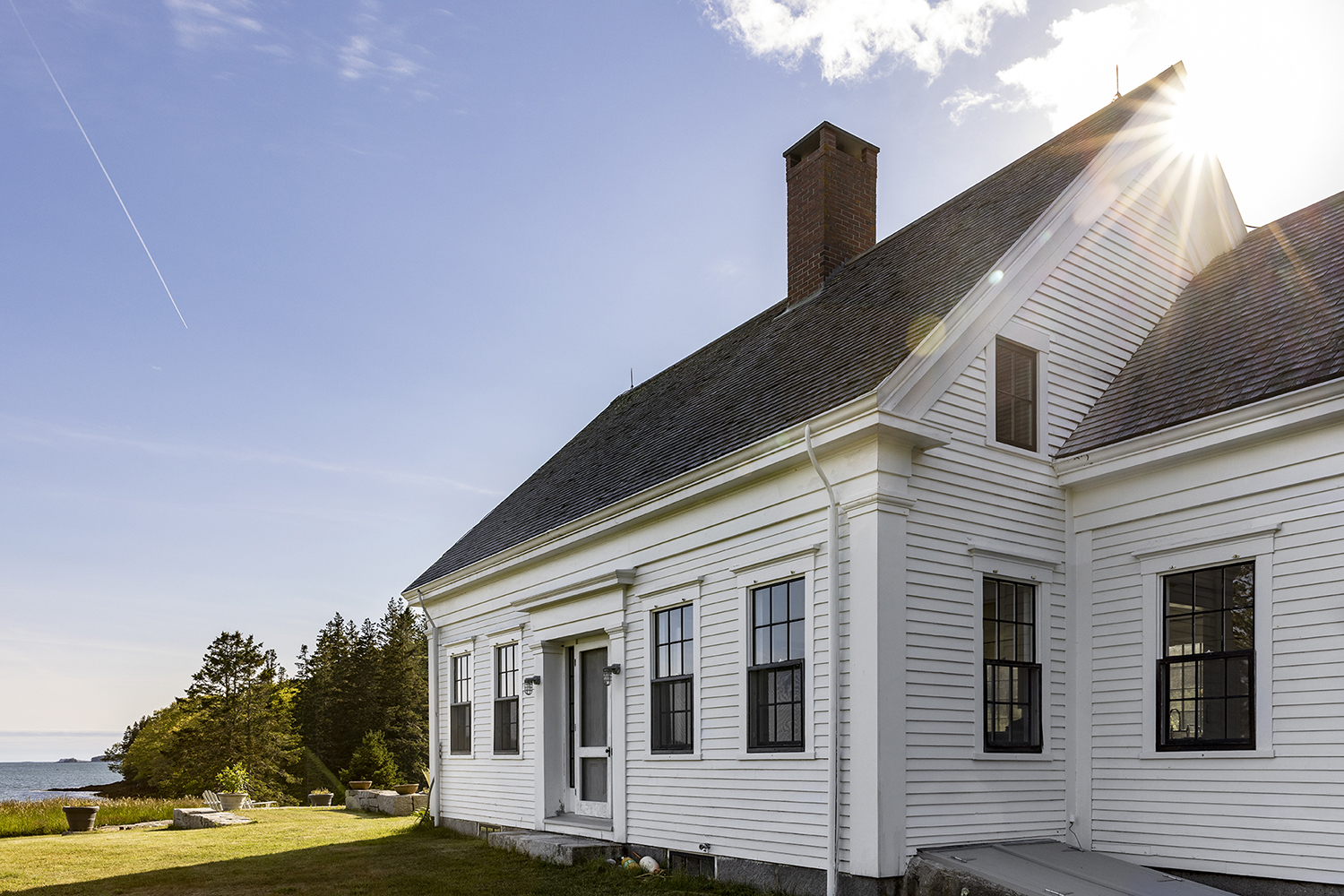An exterior photo of the renovated saltwater farm house.