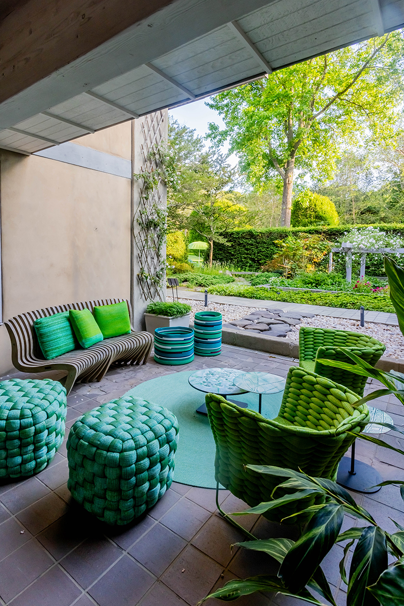 Paola Lenti Harbour sofas, Telar armchairs, and Giro tables with Sciara tops installed at the LongHouse Reserve Breezeway in East Hampton.