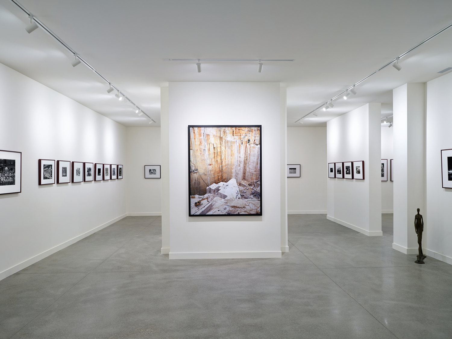 The lower level hosts a white-wall gallery space lined with contemporary artworks, including this piece by Edward Burtynsky, in the renovation by Robbins Architecture