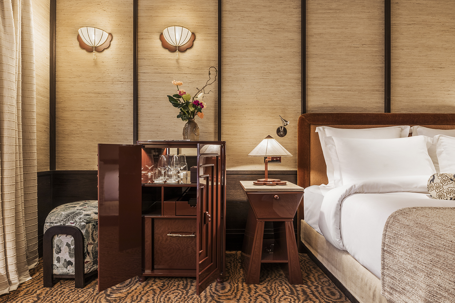 A room at Hotel Hana in Paris with straw-lined walls.