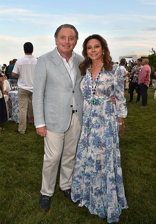 EAST HAMPTON, NY - JULY 20: James Cohen and Lisa Cohen attend God's Love We Deliver Midsummer Night Drinks Hosted By Lisa & James Cohen at Private Residence in the Hamptons