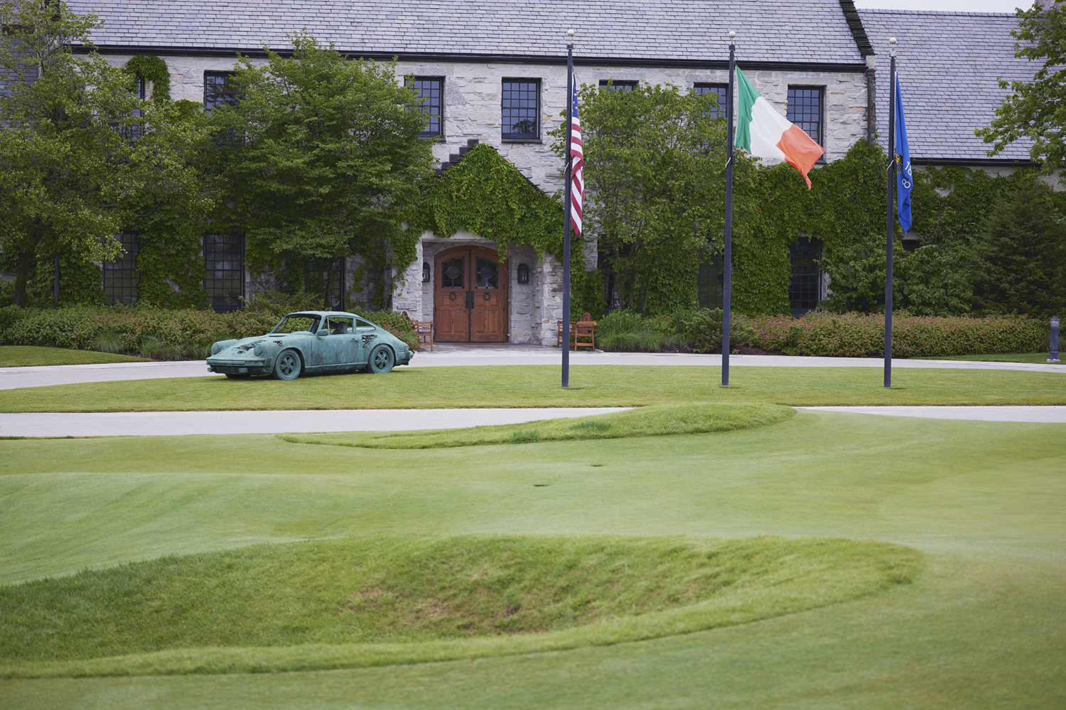 Bronze Eroded Porsche 911 by Daniel Arsham, installed at Destination Kohler's The Whistling Straits golf course clubhouse.