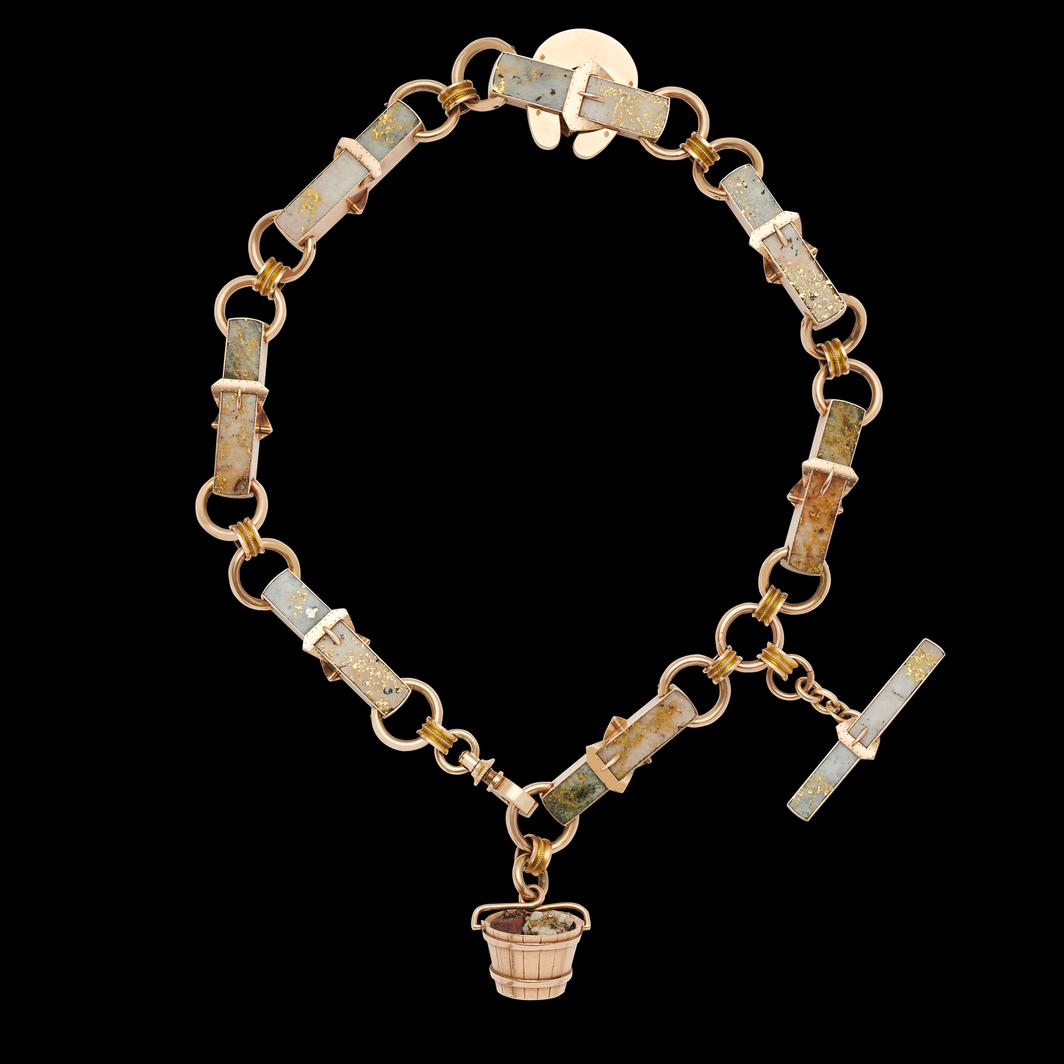 At Wartski, London dealers in the finest objets and jewels, a gold-rush watch chain decorated with buckles and finished with a tiny gold bucket was a unique piece for £150,000 on display at Treasure House.