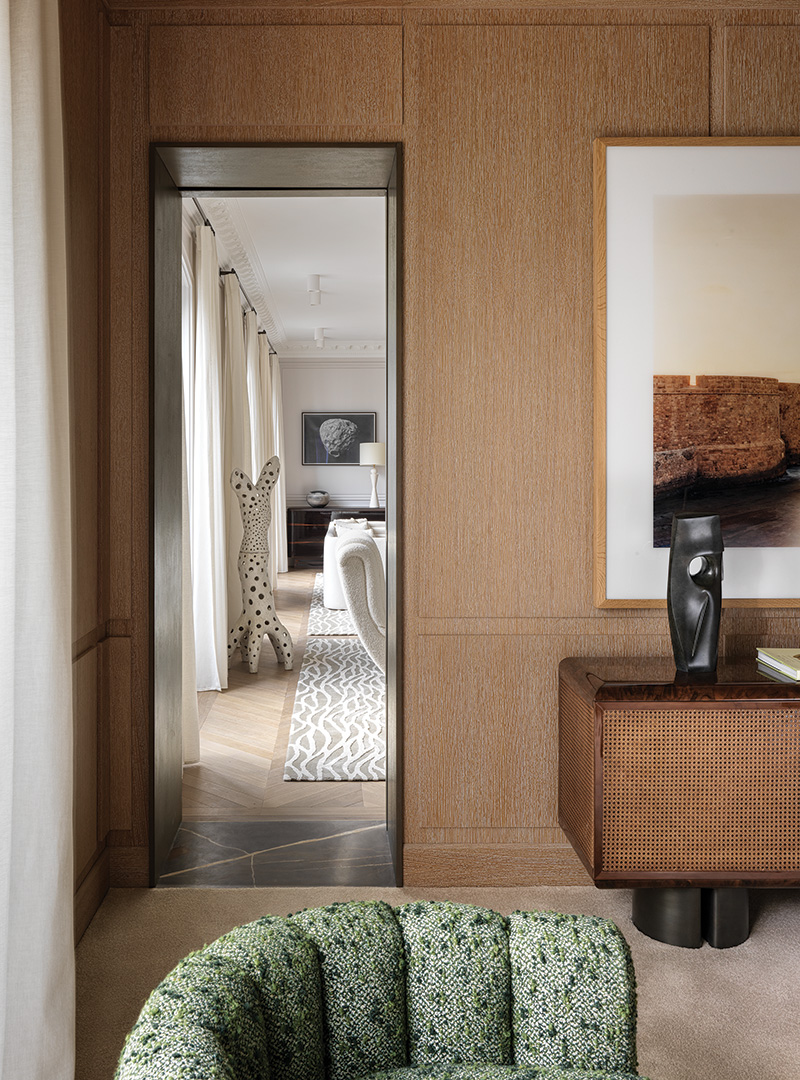 An elegant enfilade frames a sculpture by Agnès Debizet in an apartment renovated by Damien Langlois-Meurinne.