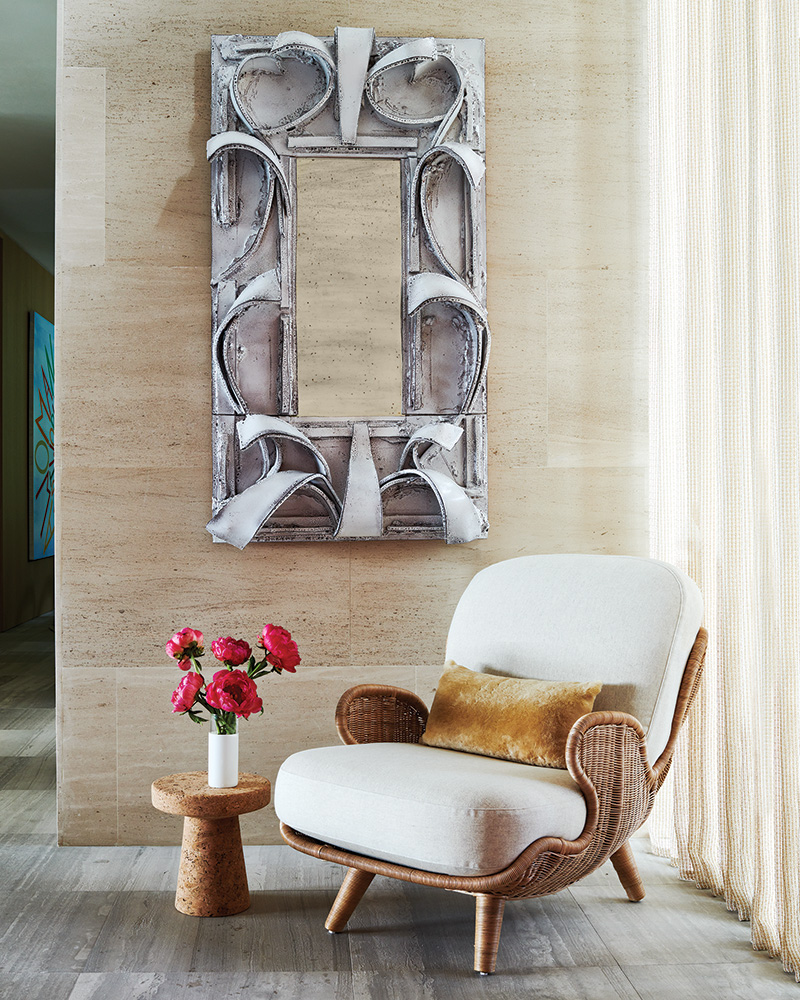 Giuseppe Ducrot mirror paired with a Mattia Bonetti lounge chair from Bonacina.