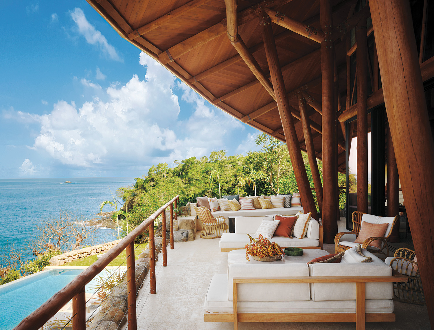 A deep-set porch off the living area runs parallel to the pool.