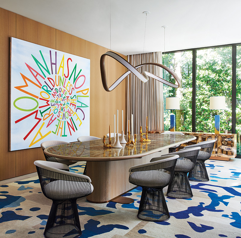 A John Procario light sculpture twists above a custom dining table by Georgis & Mirgorodsky, in this renovation by William T. Georgis.