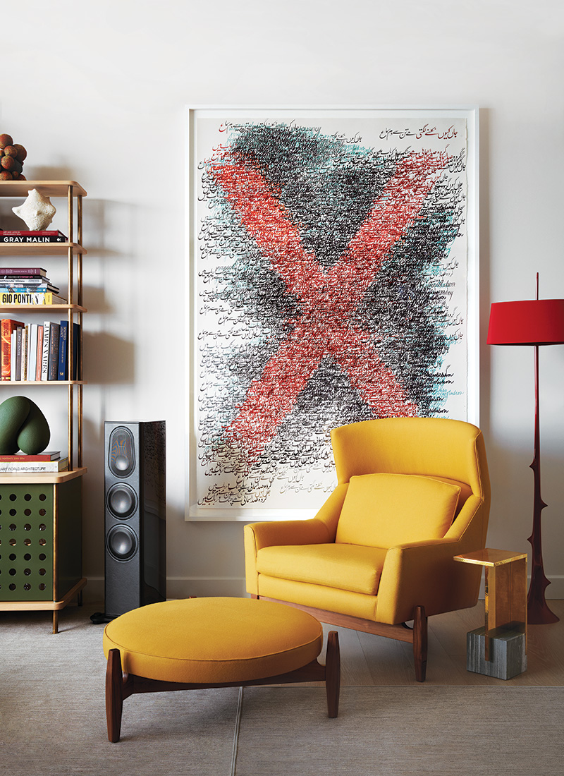 In the living room of a Manhattan apartment conceived by Shawn Henderson, a Shahzia Sikander artwork from Sean Kelly gallery overlooks a Jens Risom chair and ottoman.