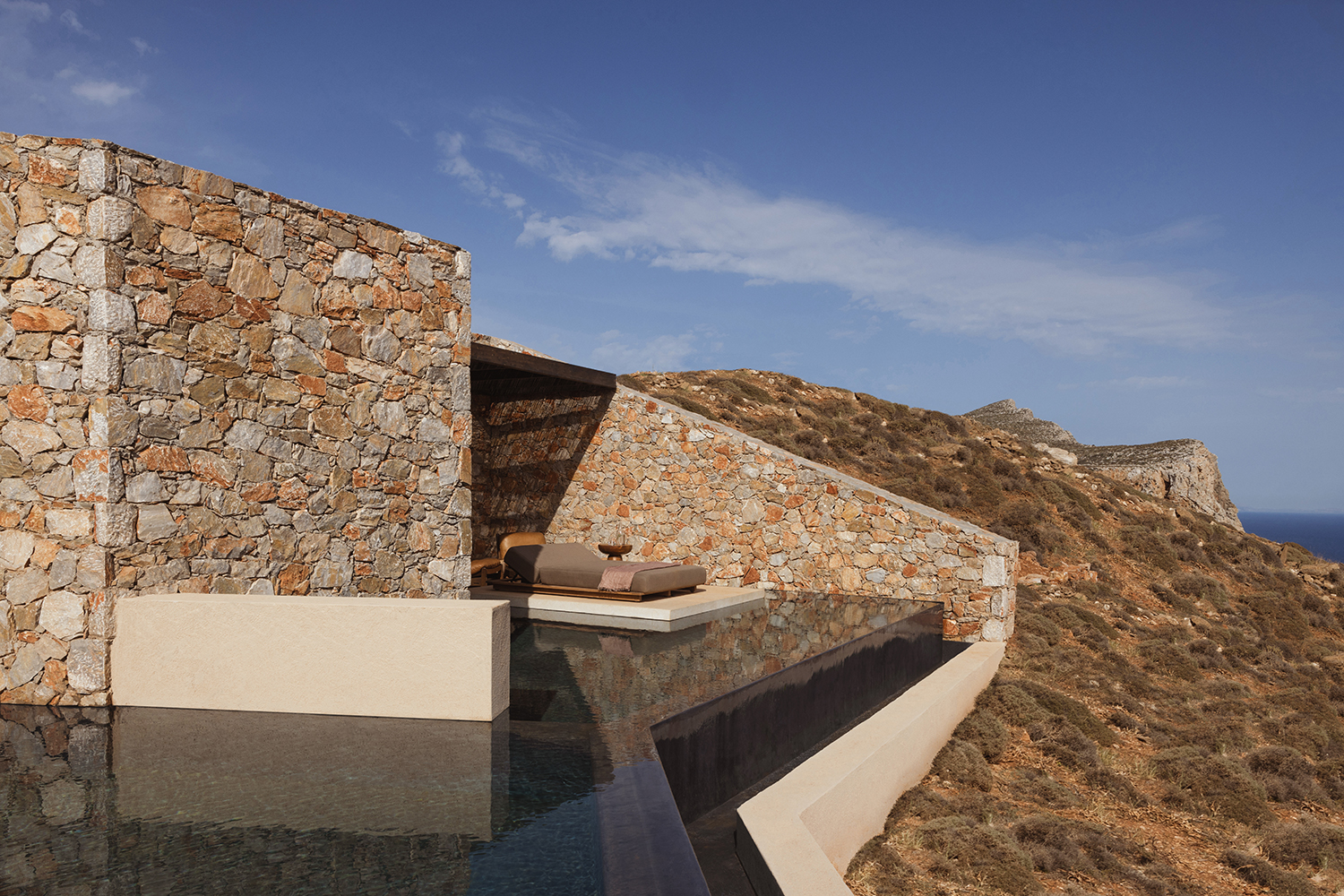 Architecture studio Block 722 designed new Folegandros, Greece, resort Gundari using natural materials, including rocks sourced from the excavation of the site.