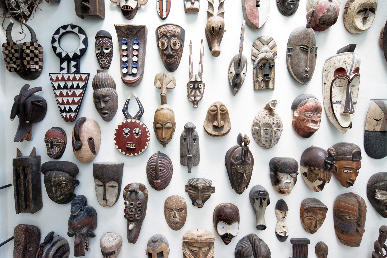 Vik Muniz has a collection of African masks at his home in Salvador, Brazil.