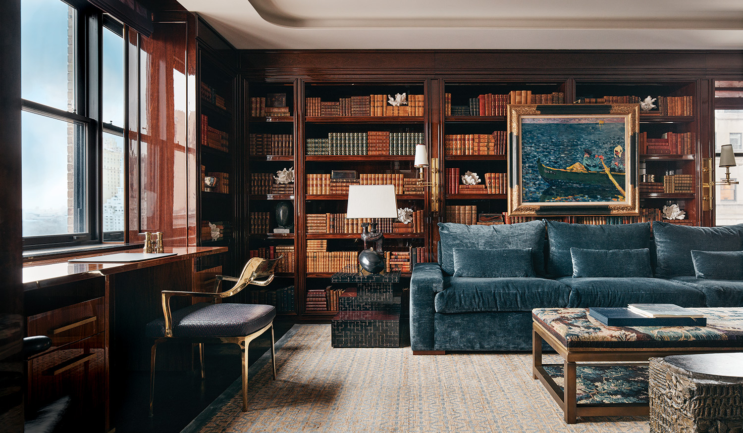 Vintage books are layered with artworks, including a Louis Valtat painting and a selection of Matthew Solomon sculptures, in the library of a Fifth Avenue home designed by Pembrooke & Ives.