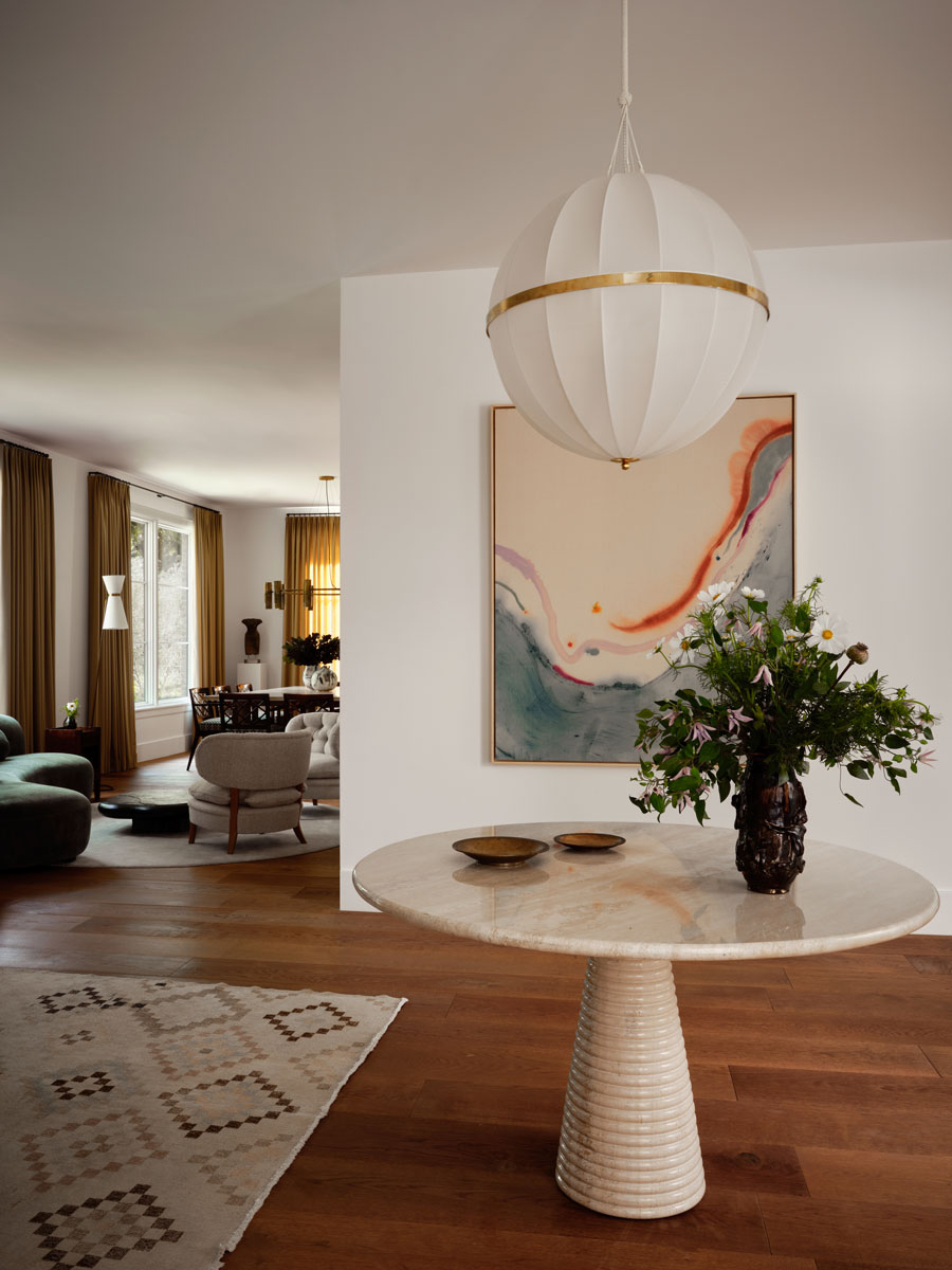 Brandon Fontenot chose a table from Italy, 1970s, art by Violeta Maya, and wall lights by Giancarlo Valle.