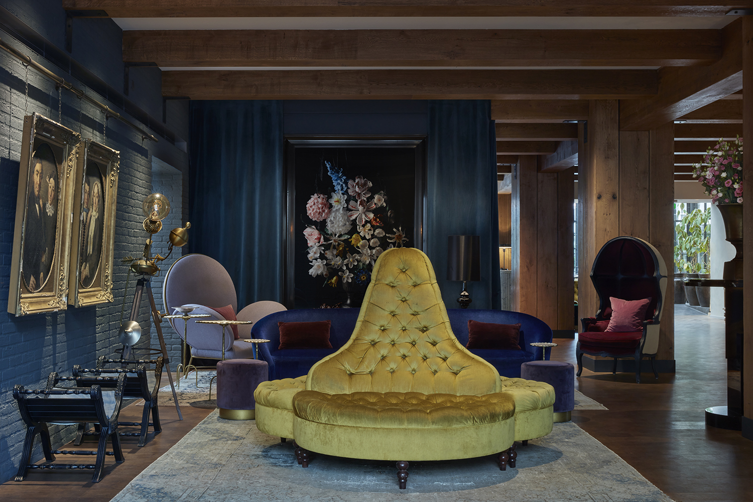 The Jacu Strauss-designed lobby at Pulitzer Amsterdam is enveloped in jewel tones and sumptuous materials.