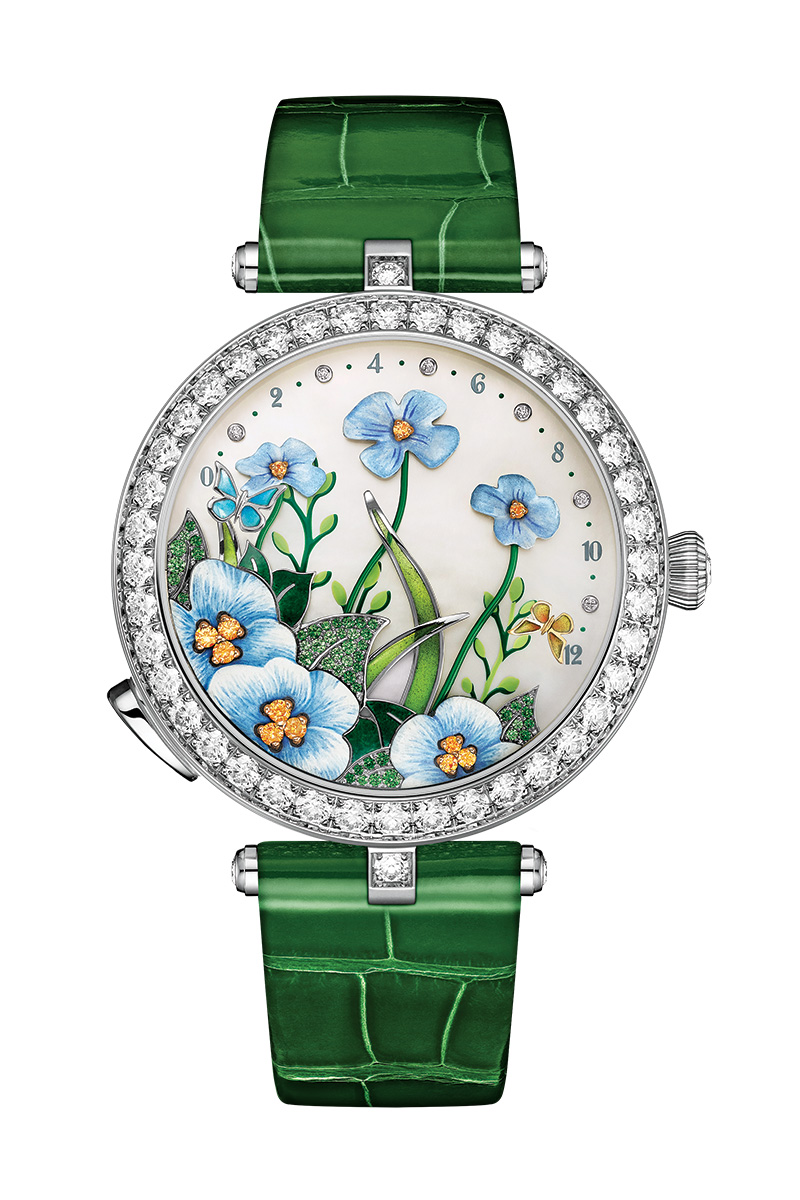 The Lady Arpels Brise d’Été watch by Van Cleef & Arpels features diamonds, tsavorites, spessartite garnets, and white mother-of-pearl set in 18K white gold.