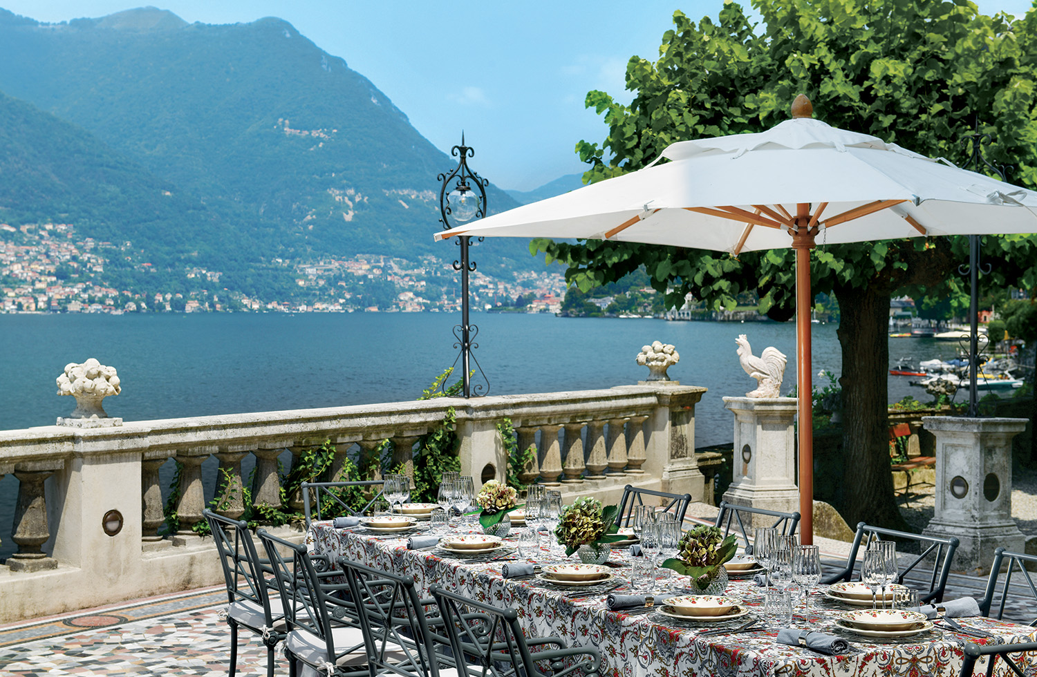 A table is set for an idyllic outdoor lunch on Lake Como.