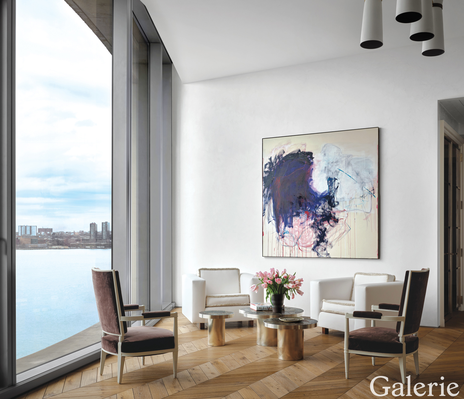 At one end of the River Room by Haynes-Roberts, a work by Tracey Emin presides over a sitting area furnished with 1940s André Arbus chairs covered in a brown Nancy Corzine silk velvet, 1969 Joaquim Tenreiro chairs upholstered in a Pierre Frey velvet, and French nesting tables from the ’70s.