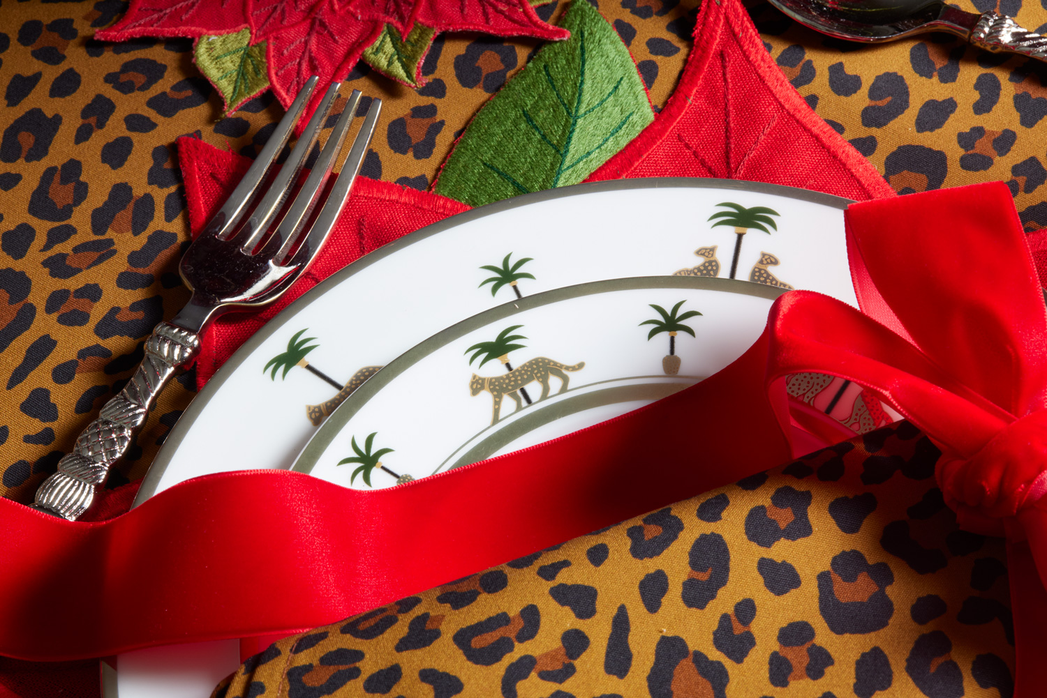 Leopard Christmas: More is more for this holiday table full of graphic prints and bold Christmas colors.