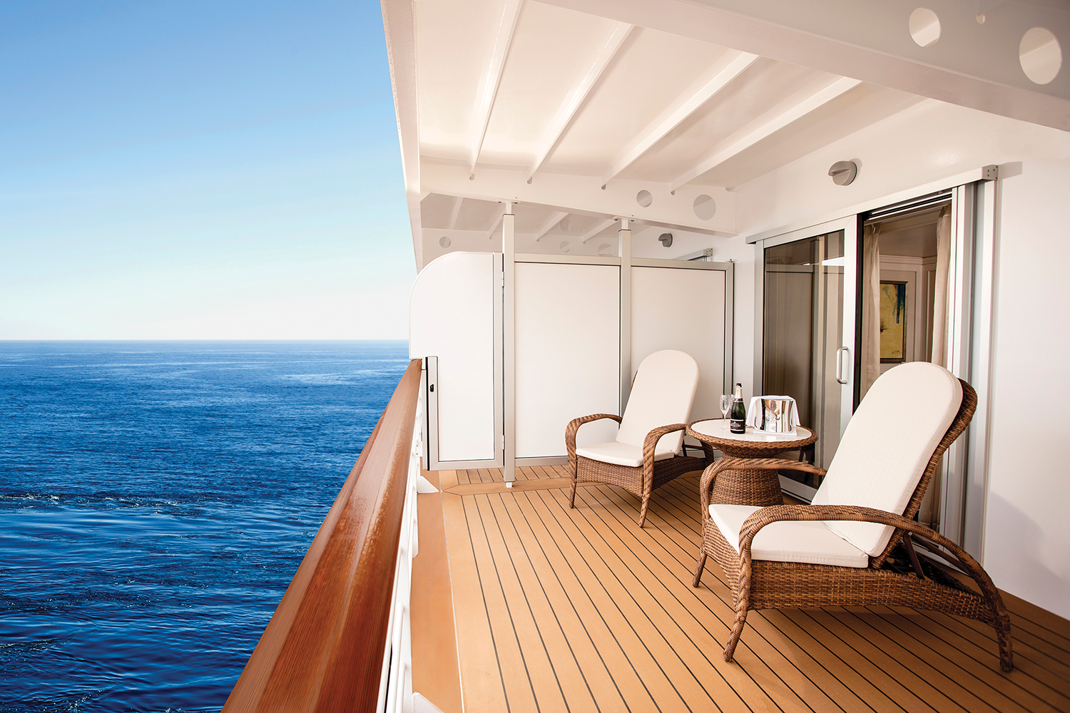 A private ocean-view balcony on board the Regent Seven Seas Explorer.