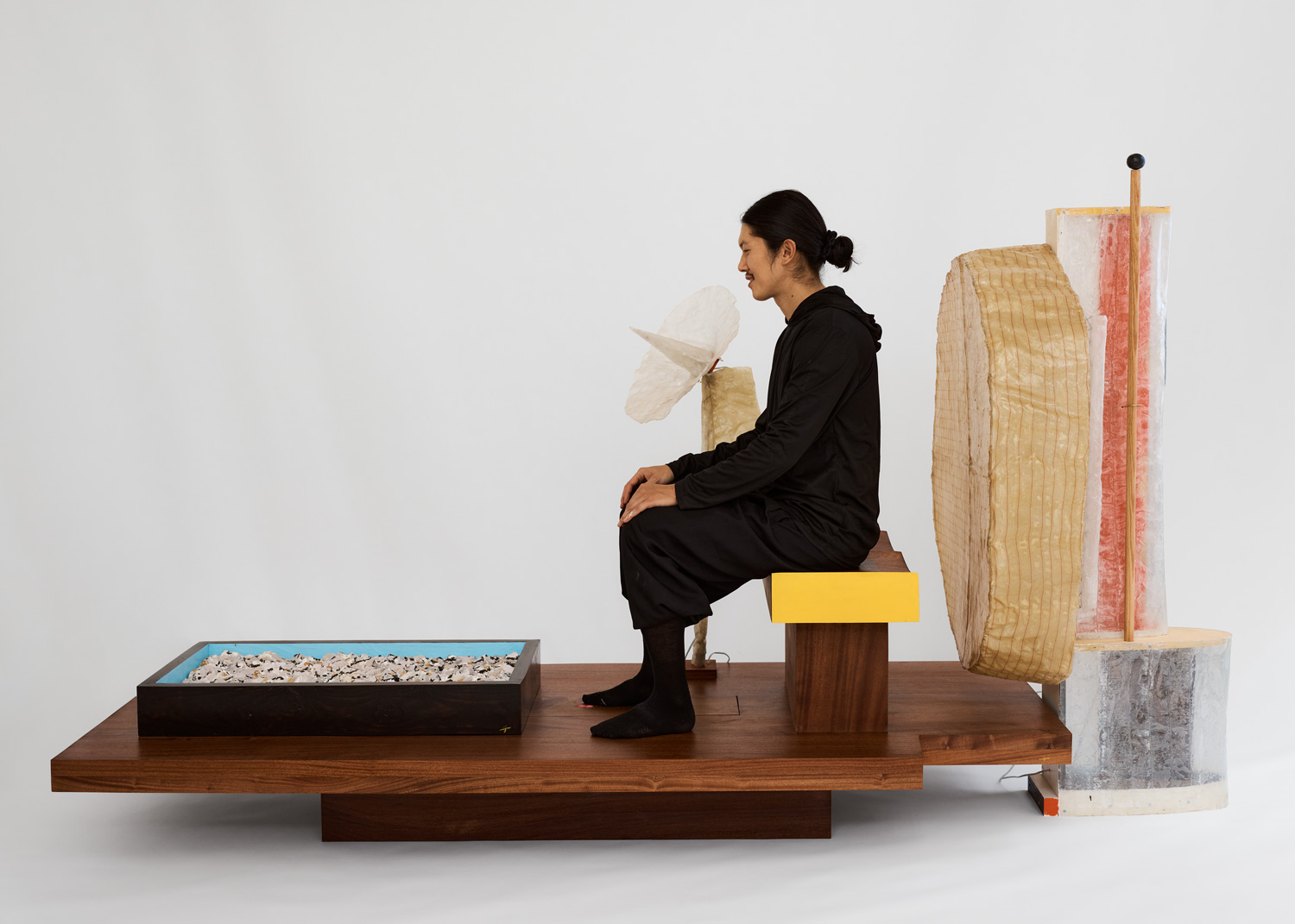 Minjae Kim pictured with Everglades Table, Tray of Oysters, Radar Lamp, Chair for Two, and Big Fan Lamp.