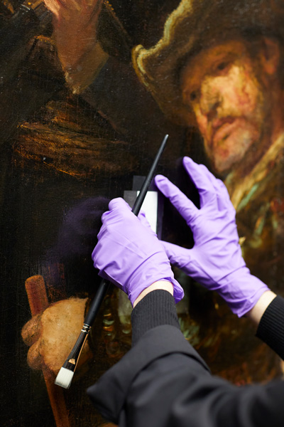 Removing varnish from Rembrandt's The Night Watch.