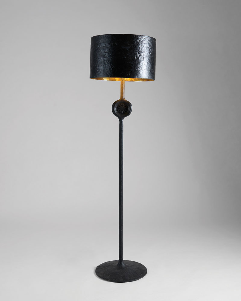 The floor lamp in Hazarian’s collection is named Arev, “god of the sun” in Armenian. Made entirely of patinated textured bronze, the piece showcases a shade with a polished interior that emanates a warm glow even when the fixture is not illuminated. Its only ornamentation is a seal in the shape of an asymmetrical sunburst.