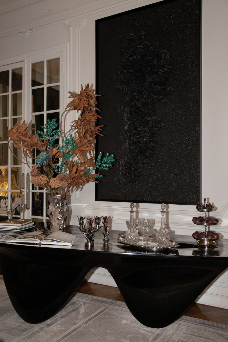 Zaha Hadid’s table composed with Marie Khoury’s abstract charcoal hinting to the map of Lebanon compose my favorite scene in the hall way of my Parisian home, a permanent tribute to origins and Lebanese roots.