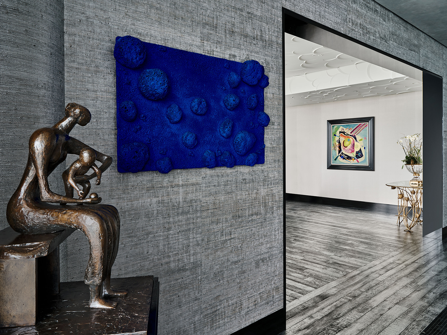 Yves Klein’s Relief Éponge bleu sans titre and Henry Moore’s Mother and Child with Apple installed in the Palm Beach residence of the late collector Sydell Miller. The Klein work hammered at $14,227,500, far outpacing its $8,000,000 to $12,000,000 estimate.