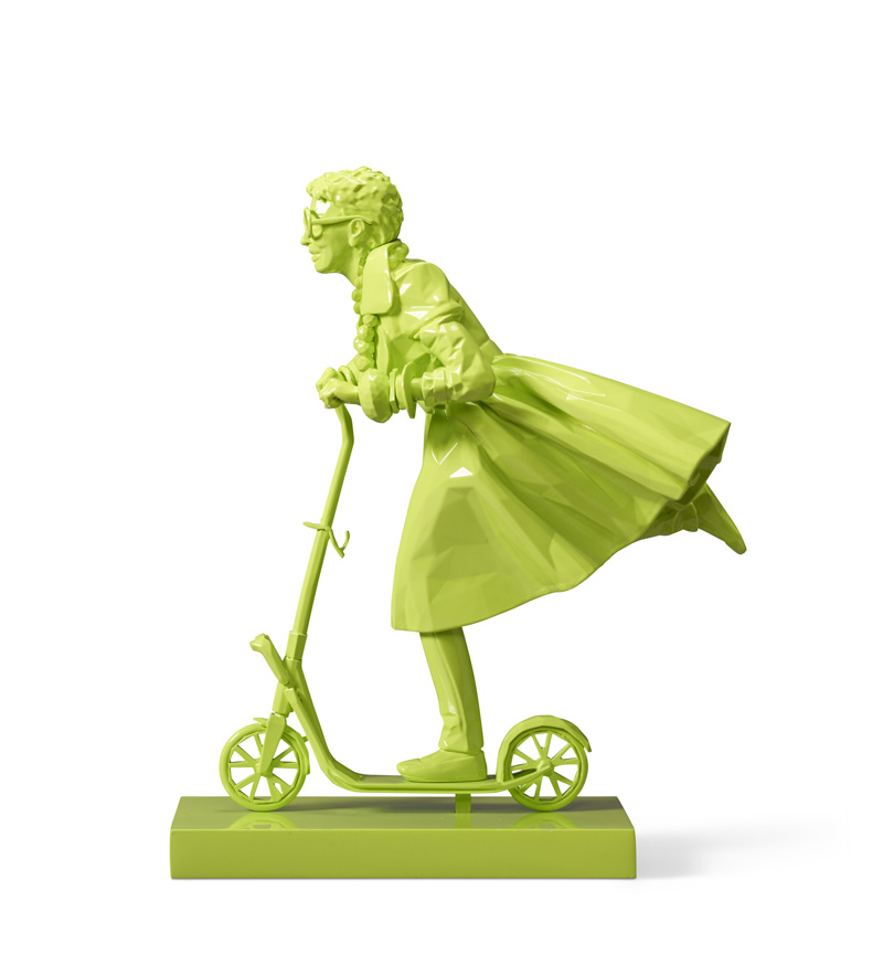 Cast resin lime green figure of Iris Apfel riding a scooter.