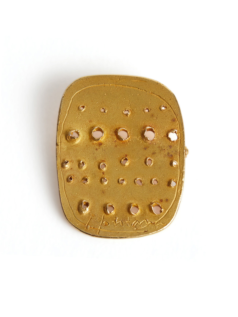 Gold brooch by Lucio Fontana.