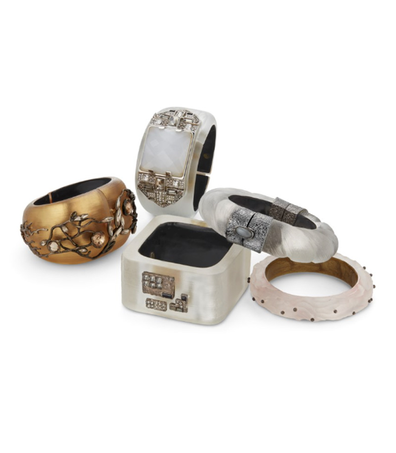 A group of five hand-carved lucite bangles.