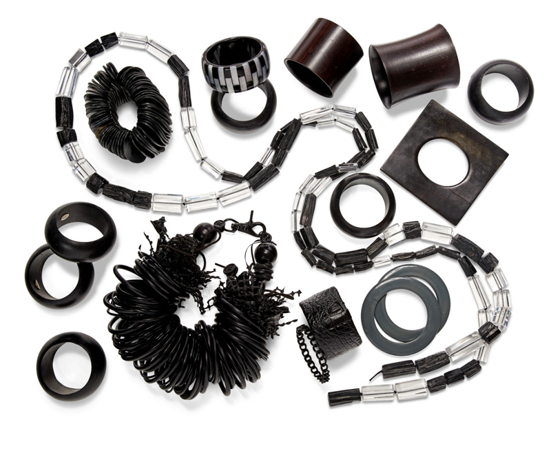 A quantity of black bangles and necklaces.