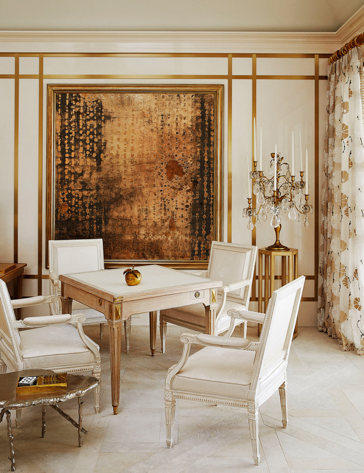 A Nancy Lorenz painting shimmers behind eighteenth-century French armchairs and a games table from Gerald Bland. The candelabra is from R. Louis Bofferding; the Claude Lalanne Pomme Bouche is from Galerie Chastel Maréchal