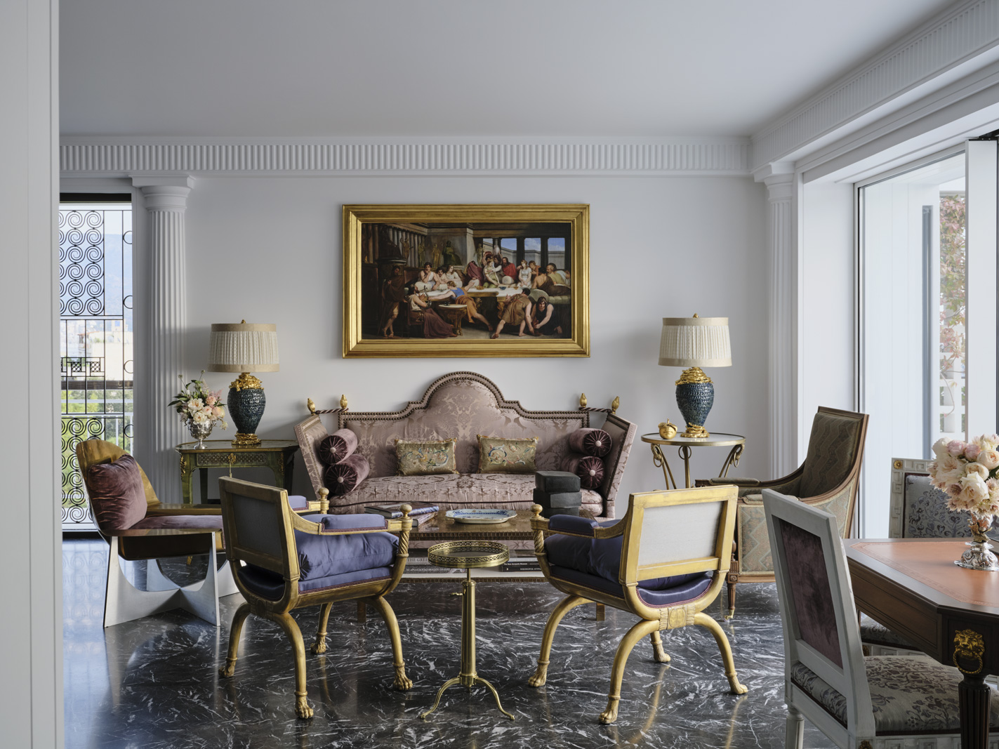 A custom Alex Papachristidis sofa dressed in a Claremont Furnishing fabric faces, from left, a Philippe Hiquily chair, a pair of armchairs from Carlton Hobbs, and accustomed LouisXVI–style chair by Alex Papachristidis.