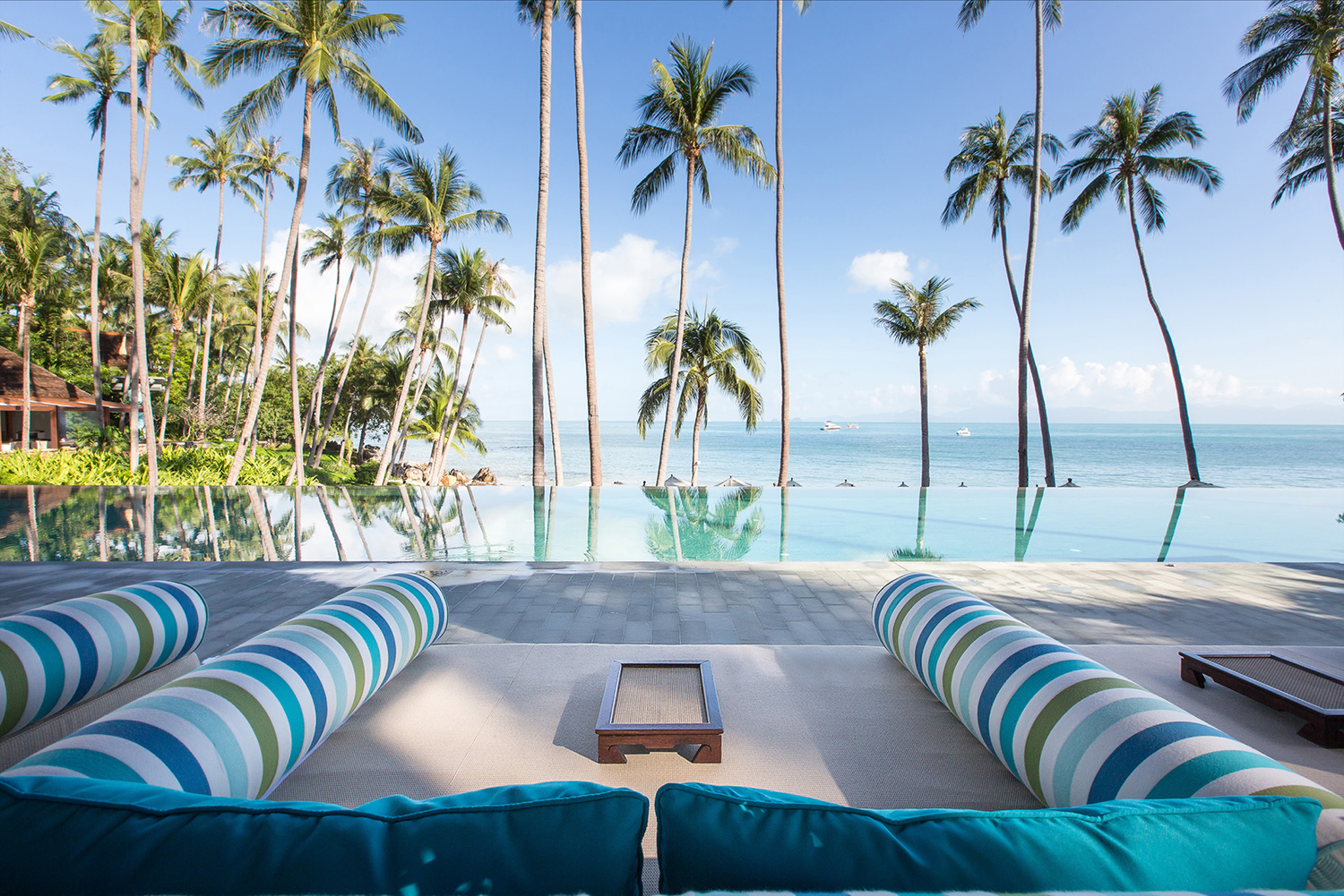 Lounge area overlooking the pool and ocean at Four Seasons Resort Koh Samui in Thailand, which is the setting for the third season of HBO’s The White Lotus.