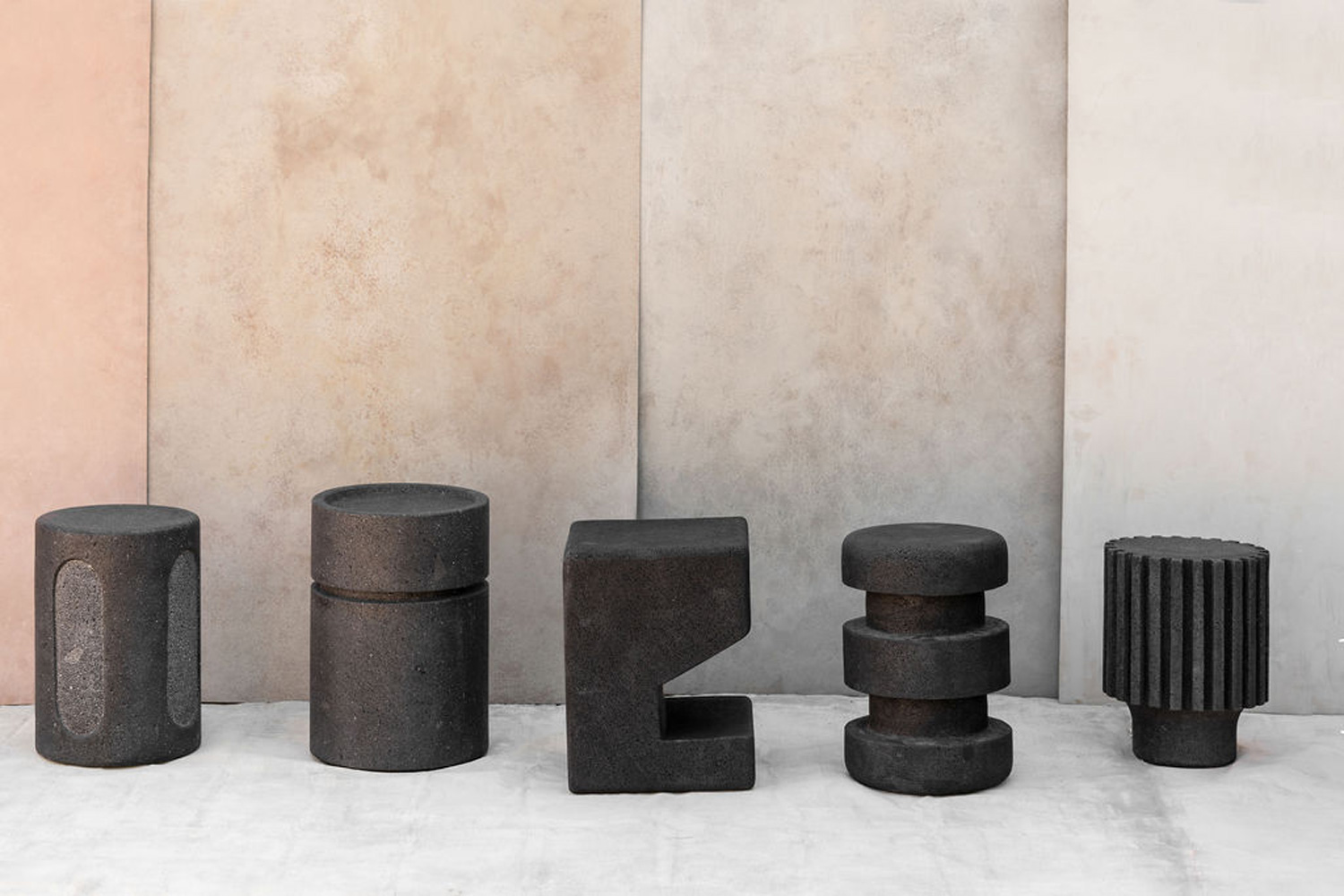 Geometric stools carved from various stones, including volcanic rock and marble, designed by Carmen Castillo Badio, founder of Ente Arte.Objeto.