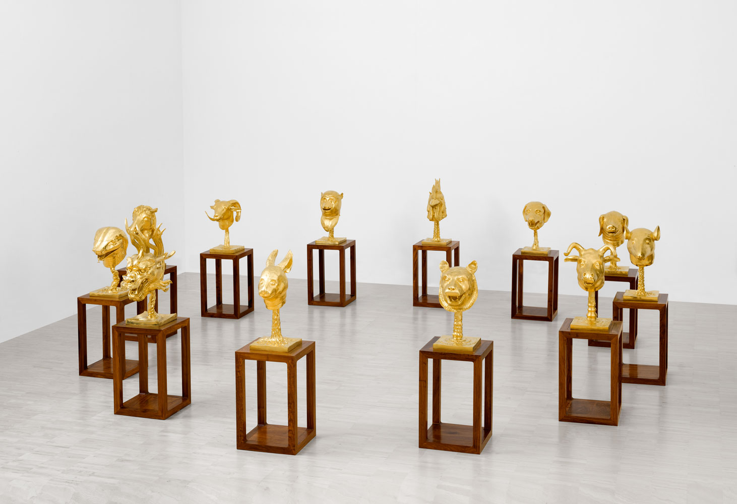 Installation view of Circle of Animals/Zodiac Heads (Gold), 2010, Ai Weiwei, Chinese, b. 1957, bronze with gold plating and wood bases