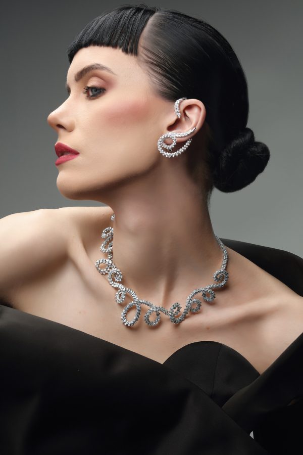 A model wears the Y-Couture statement necklace and Climber earrings.