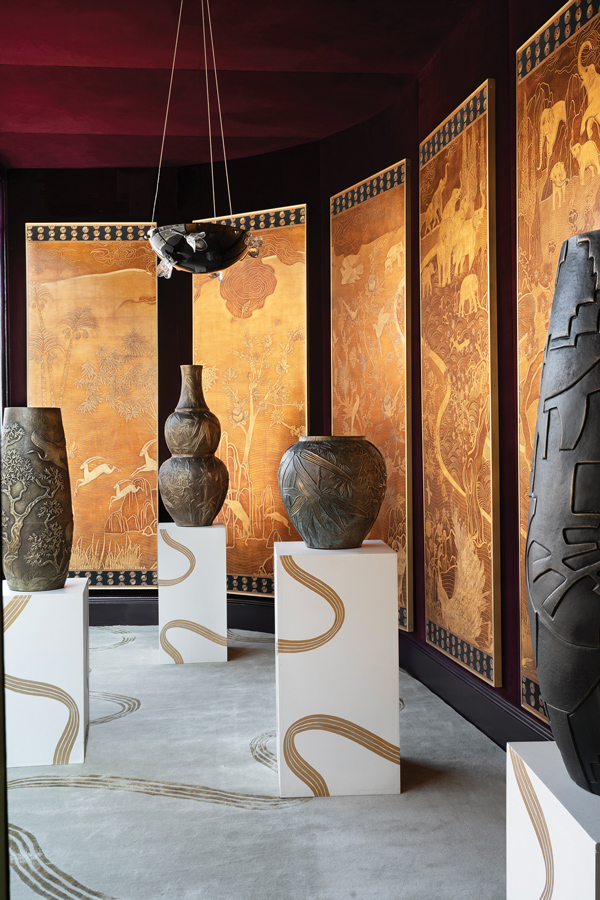 The designer's repoussé vessels and wallpaper collection with de Gournay.