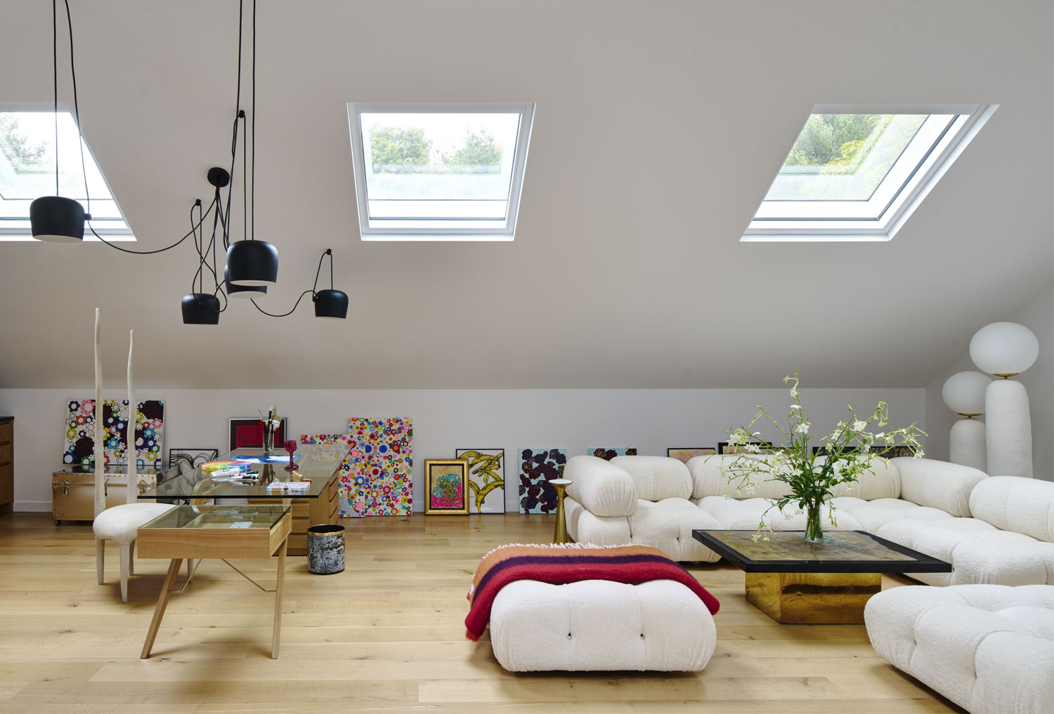 The artist loft features an Oo Floor Lamp by Eny Lee Parker