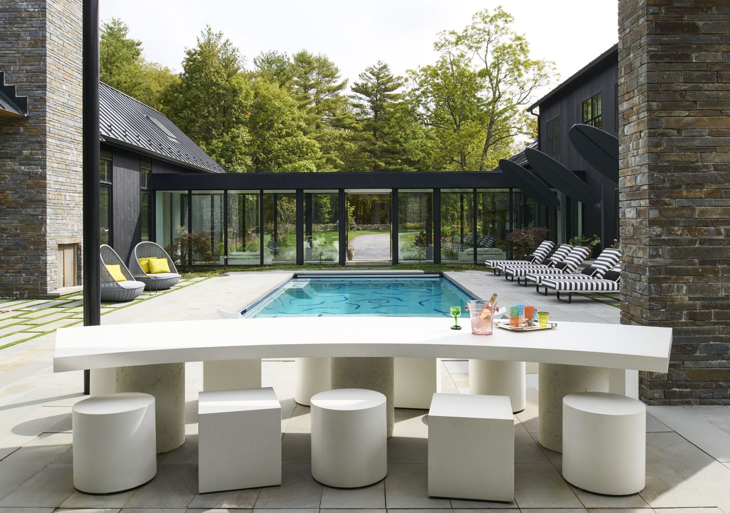 Custom Concrete Table and Chairs by Trueform Concrete in the pool house.
