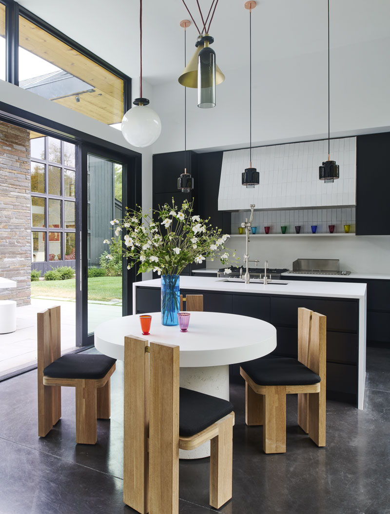 Custom Limestone Table by Trueform Concrete, Plateau dining chairs by Bonetti-Kozerski, Shape-Up Pendant by Roll & Hill.
