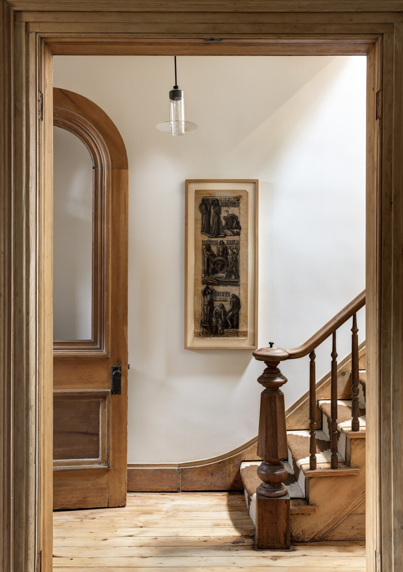 The Federal-style brick townhouse retains its period details.
